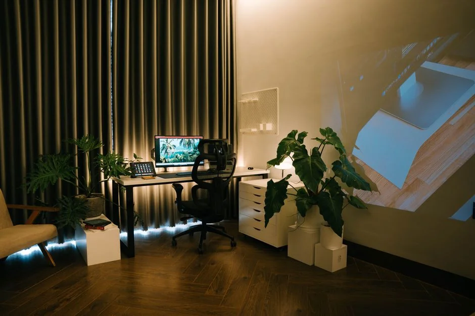 A contemporary workspace showcasing a laptop, tablet, and smartphones, ideal for tech and freelance use.